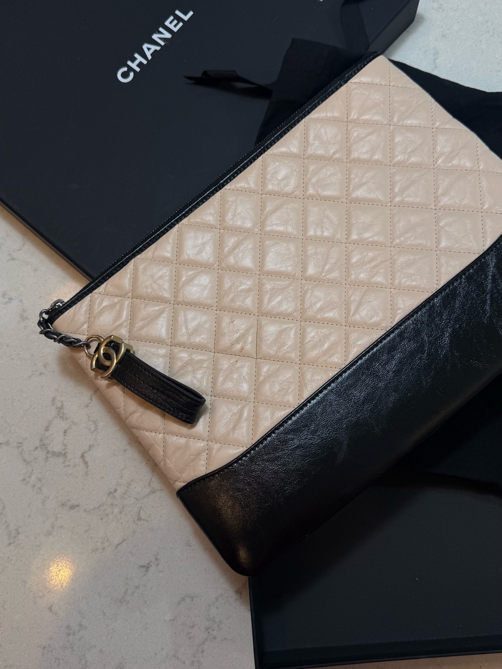 CHANEL Two-Tone Quilted Leather Wristlet Clutch in Beige and Black
